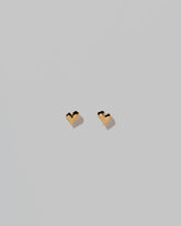 Shape Two Small Thousand & One Night Heart Stud Earrings on light color background.