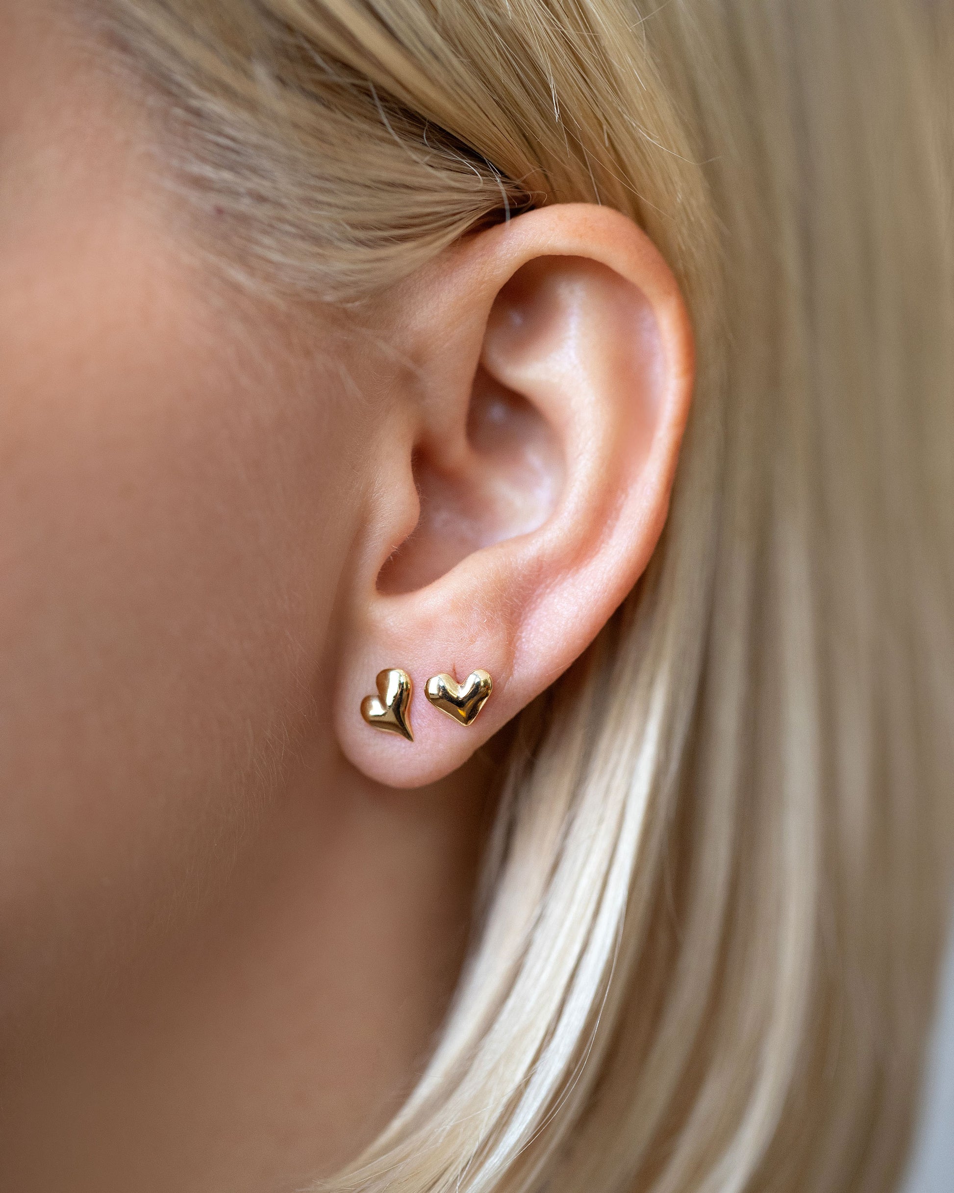 Shape Four and Shape Two Small Thousand & One Night Heart Stud Earring singles on model.