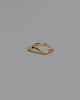 View from the side of the Gold Precise Band on light color background.