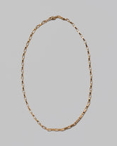 Flat Oval Link Chain Necklace on light color background.