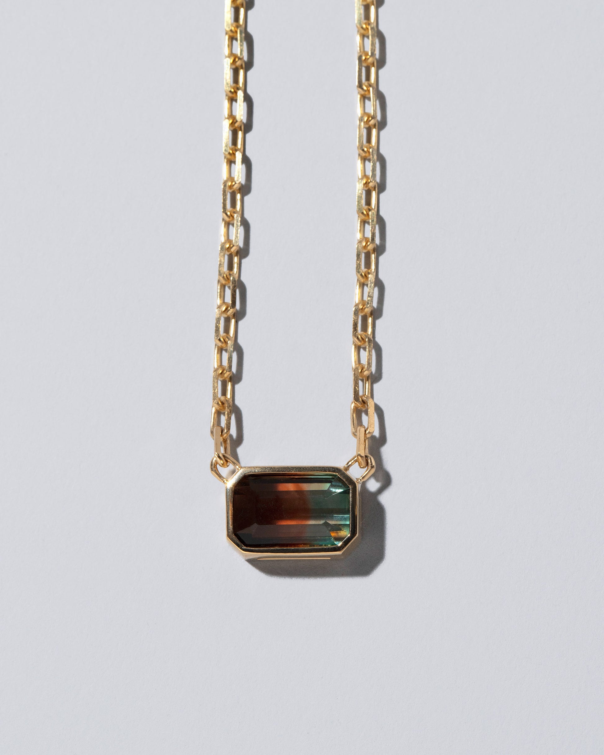 Closeup details of the Field of Love Necklace on light color background.