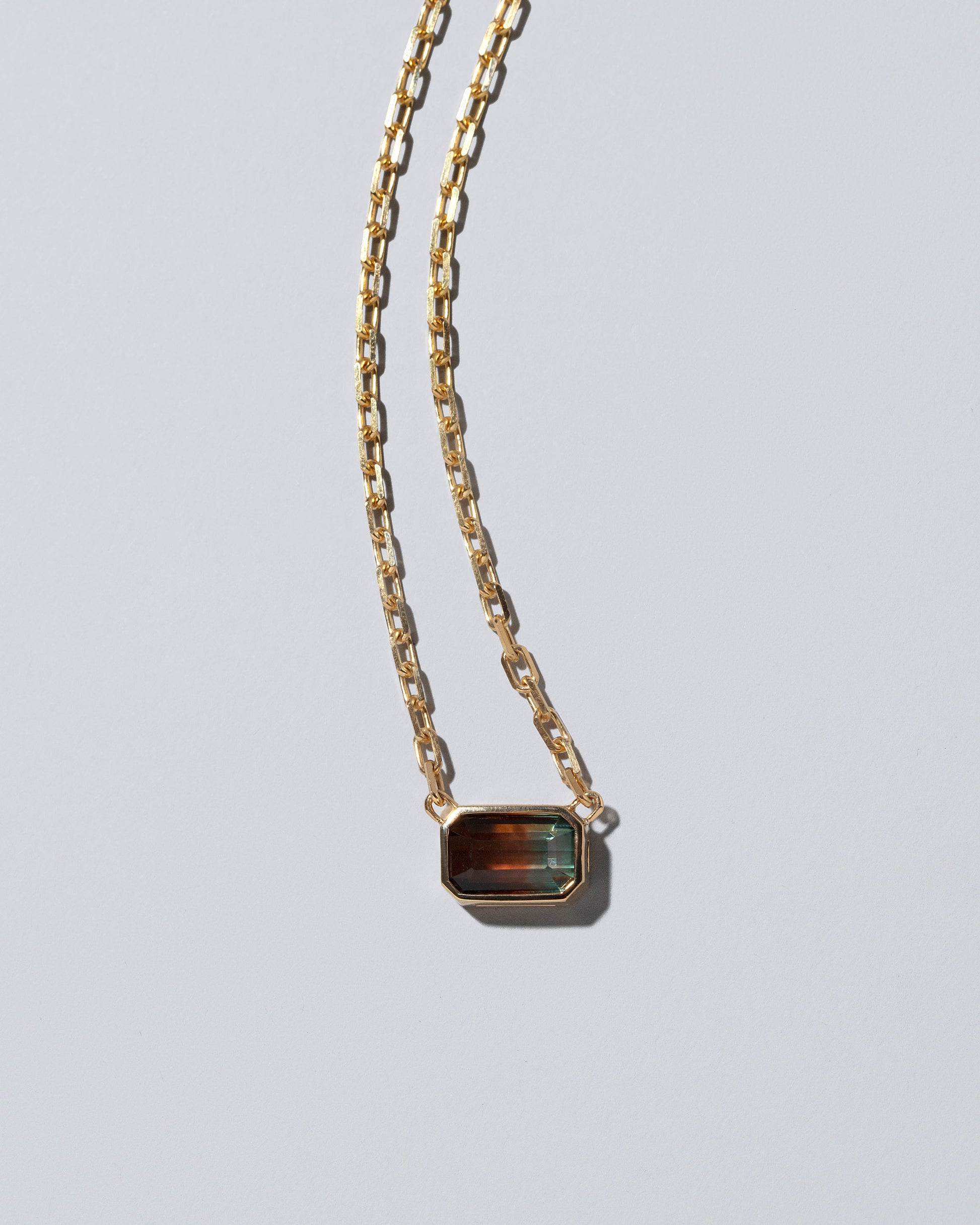 Closeup details of the Field of Love Necklace on light color background.