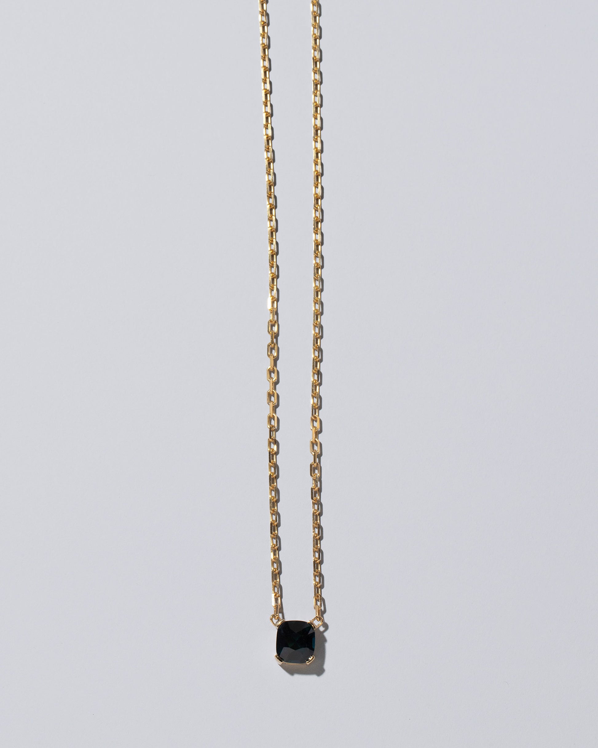 Awareness Necklace on light color background.