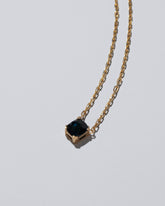 Closeup details of the Awareness Necklace on light color background.