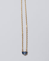 Reverence Necklace on light color background.