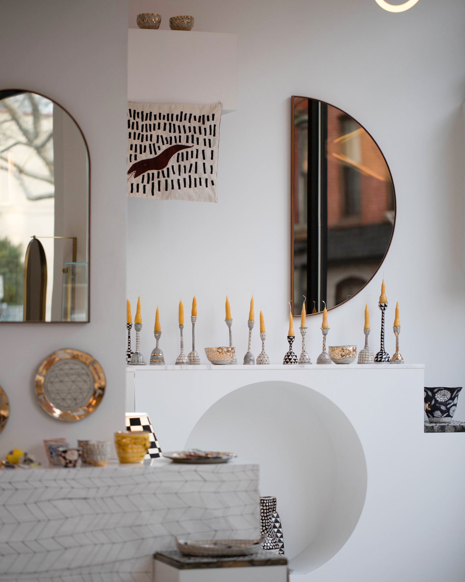 Styled image of the "Considering Utility" solo gallery showcase of Suzanne Sullivan's ceramics.