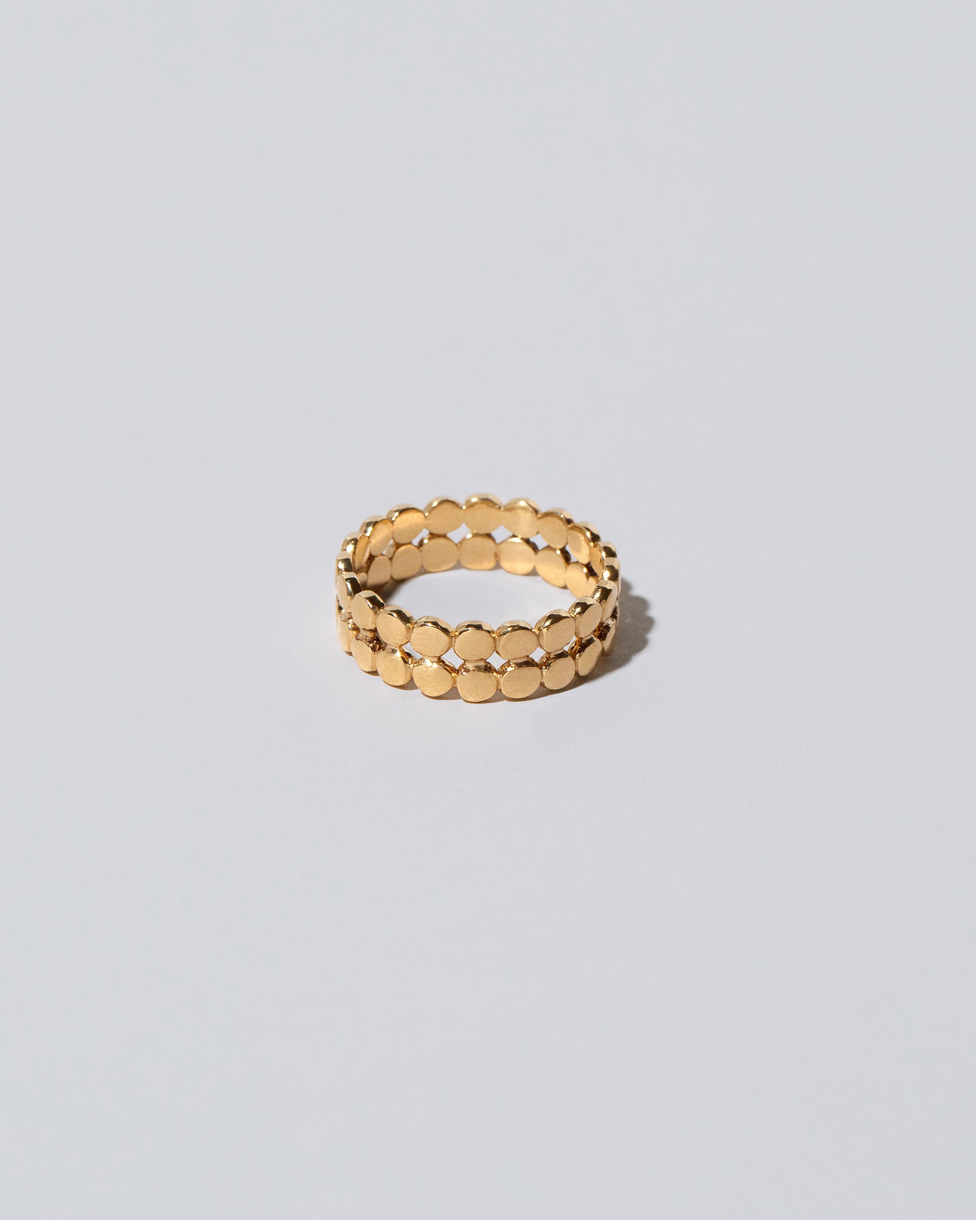 Gold Two Tier Mimosa Band on light color background.
