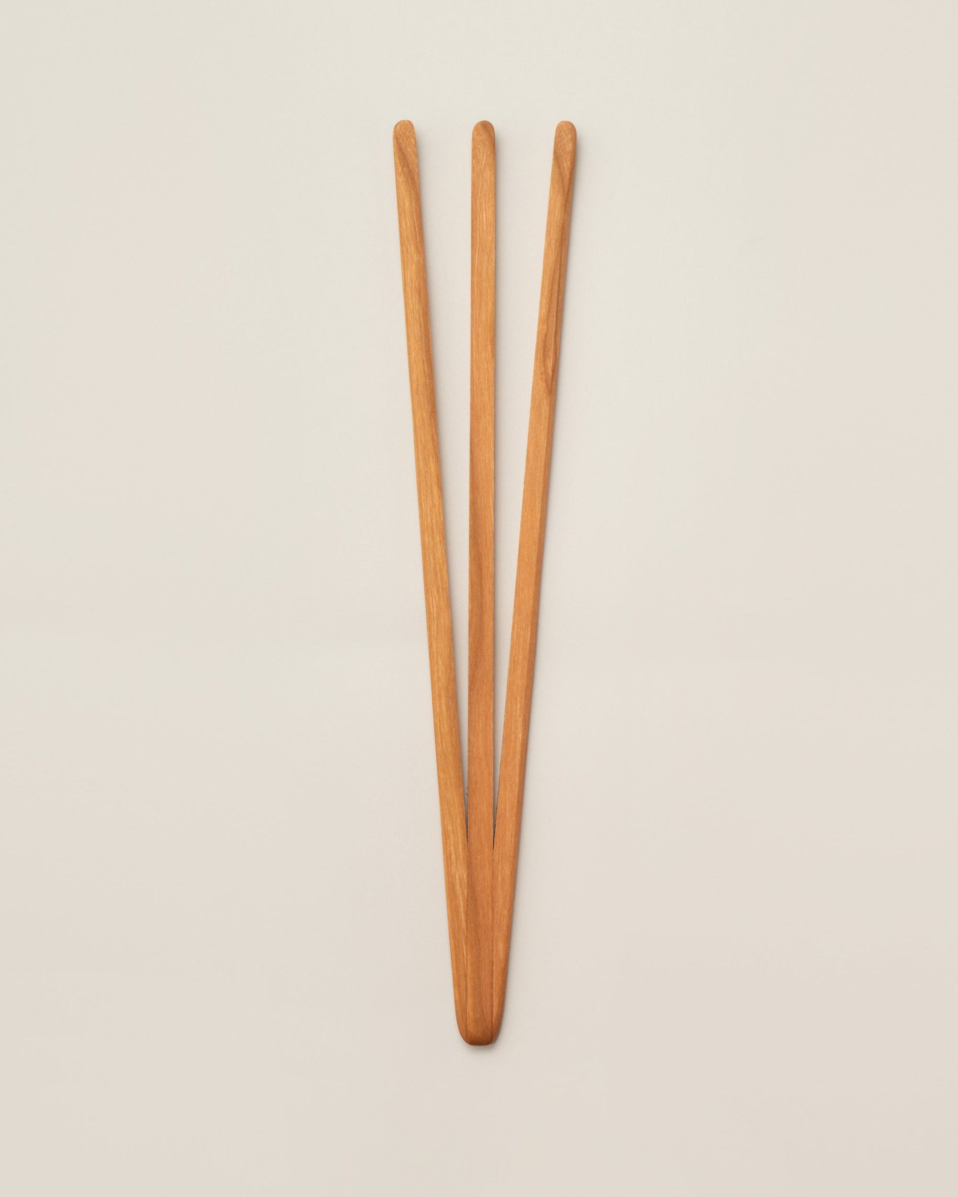 Jonathan's Spoons Pasta Utensil on light color background.