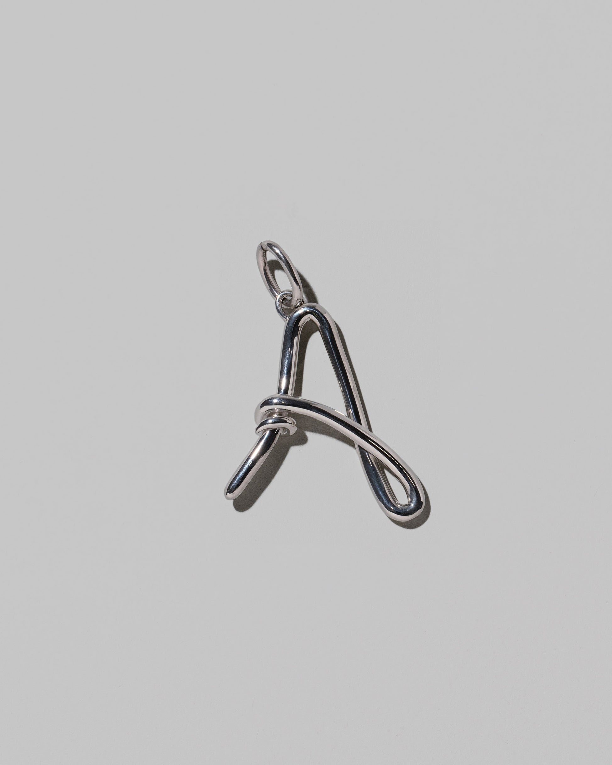 CRZM Large Letter A Charm set in sterling silver on light color background.