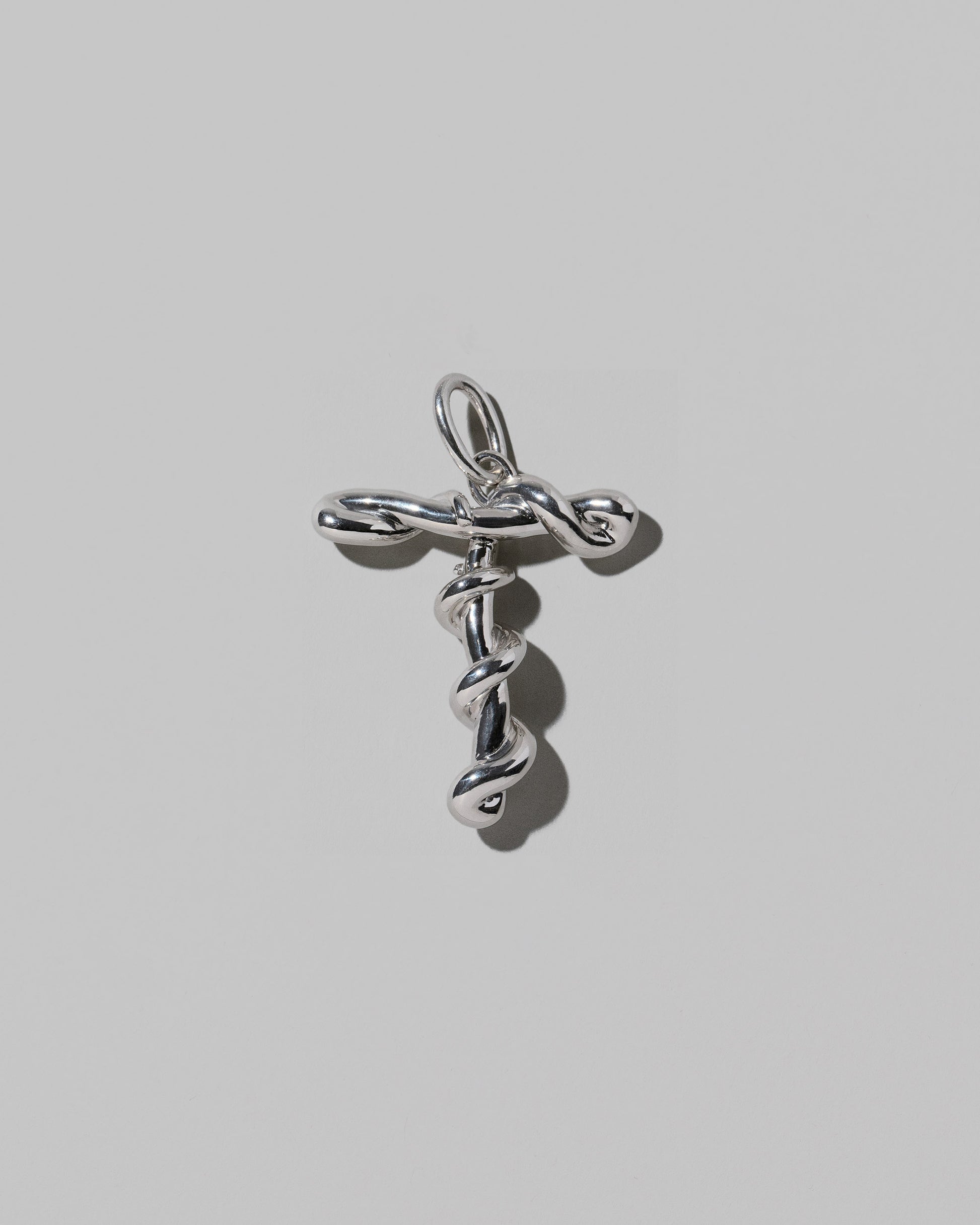 CRZM Large Letter T Charm set in sterling silver on light color background.