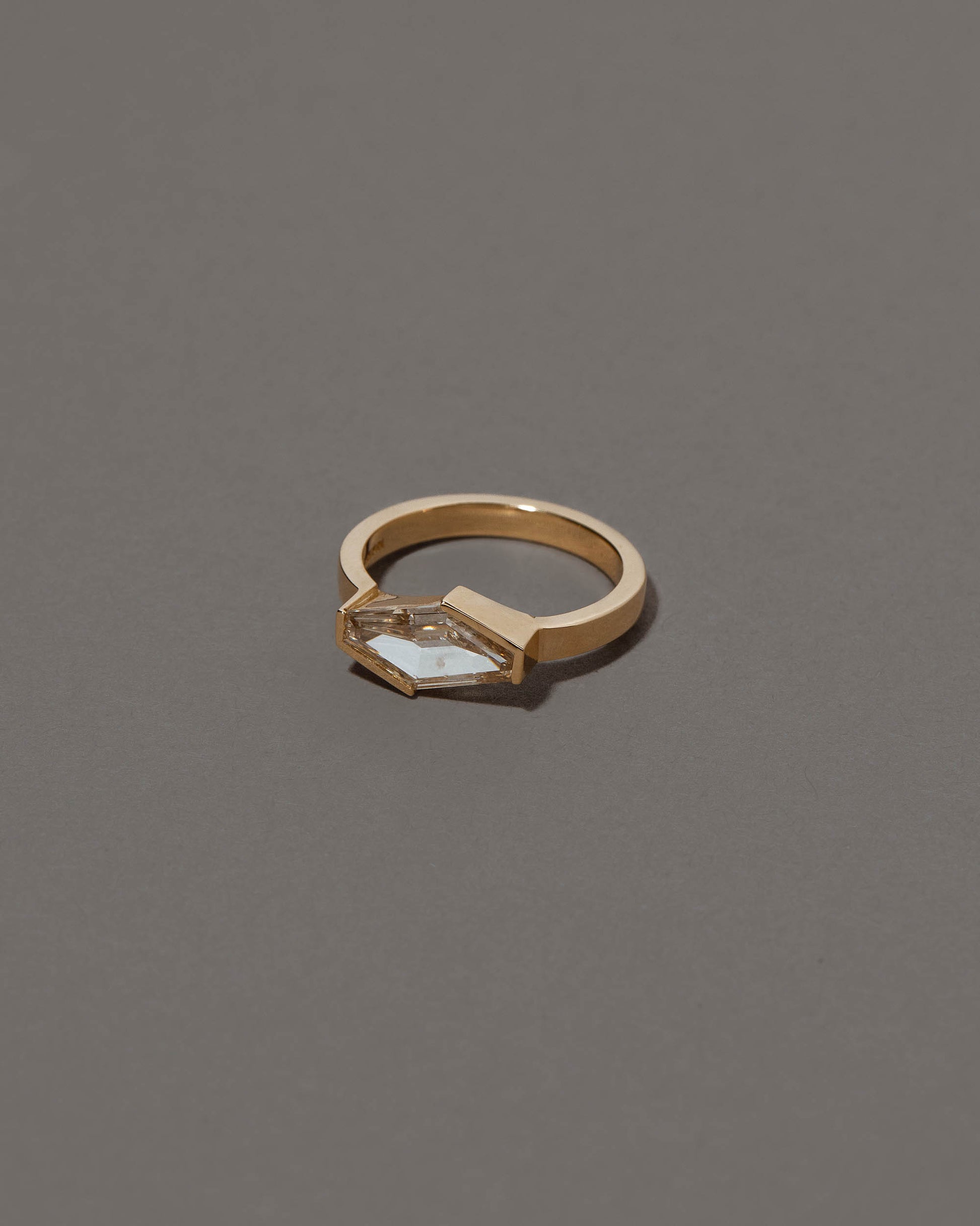 View from the side of the Mirth Ring on grey color background.