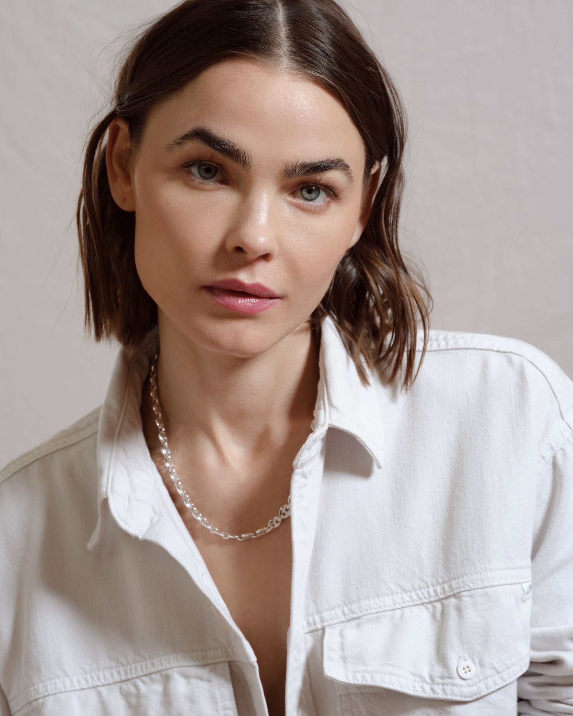 Styled image featuring CRZM jewelry on model.