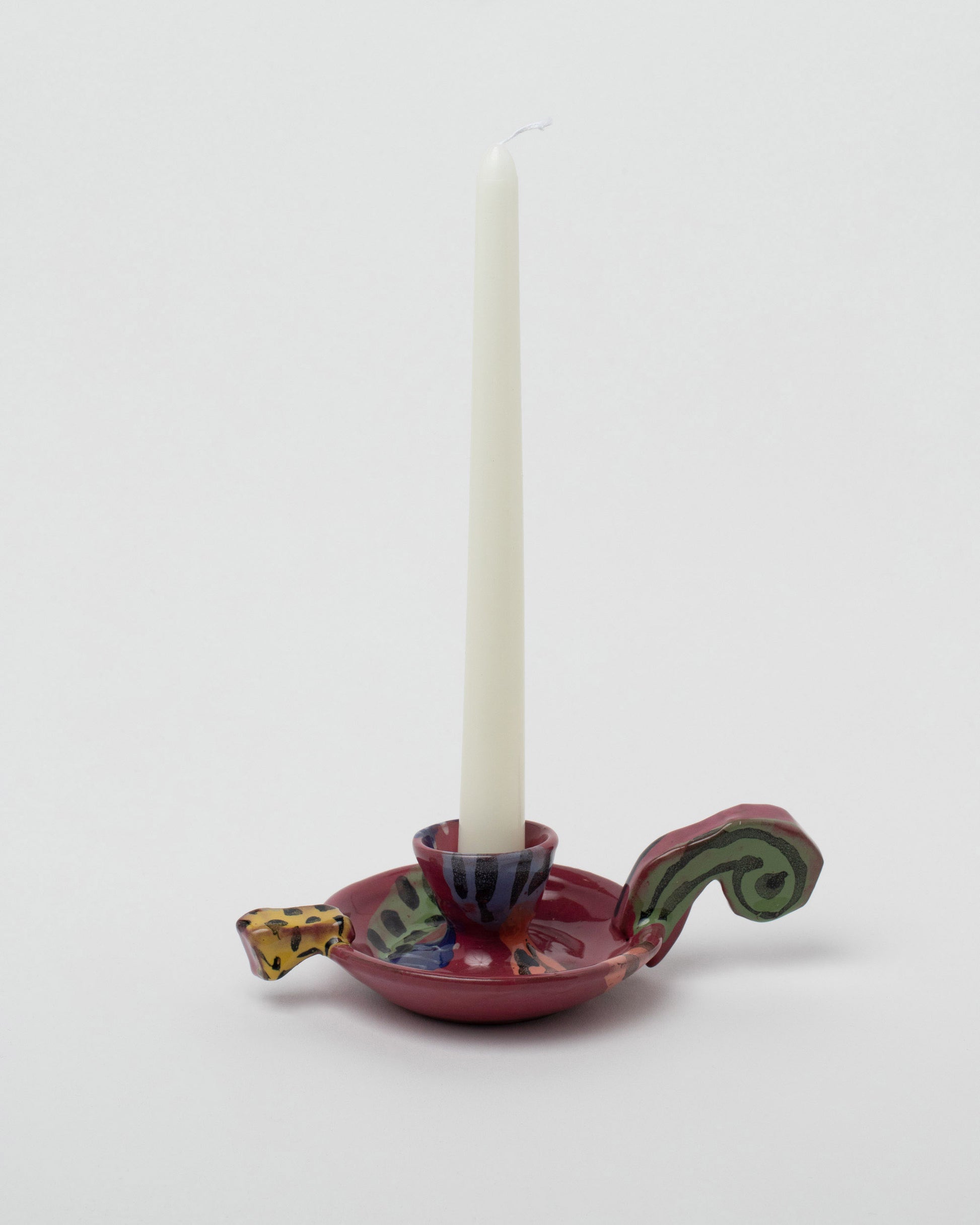 Detail view of the Maggie Boyd Candle Holder With Short Handle on light color background.