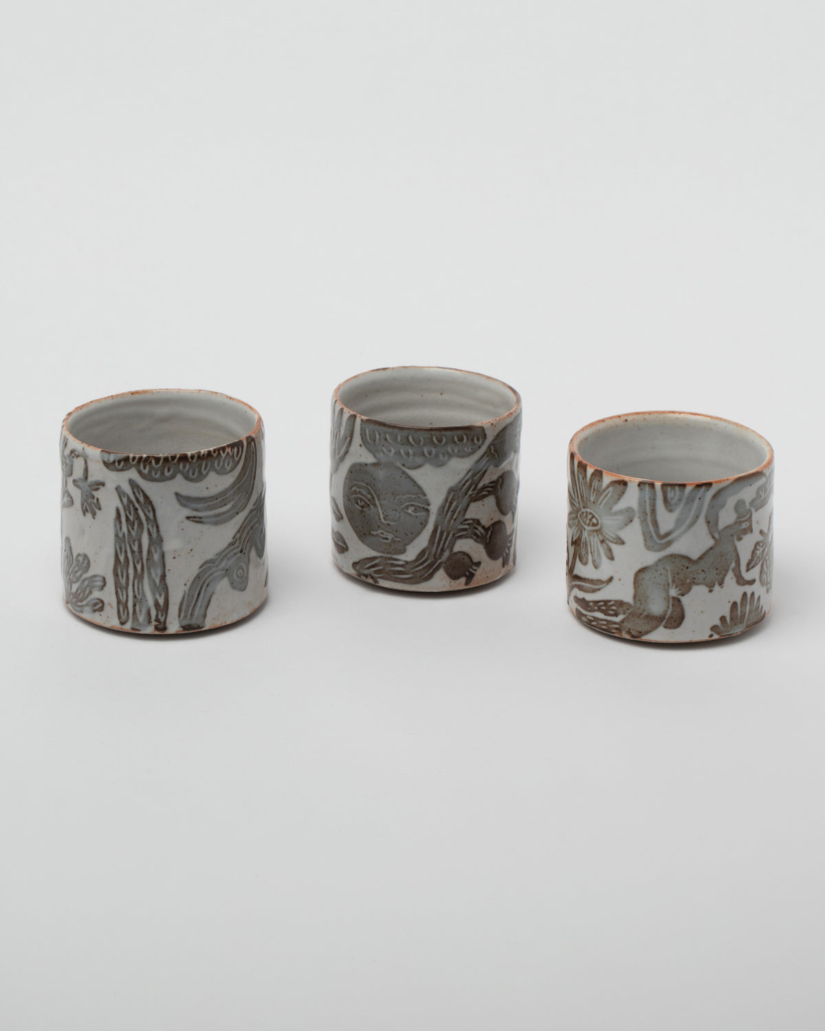 Maggie Boyd Shino Tea Bowls on light color background.