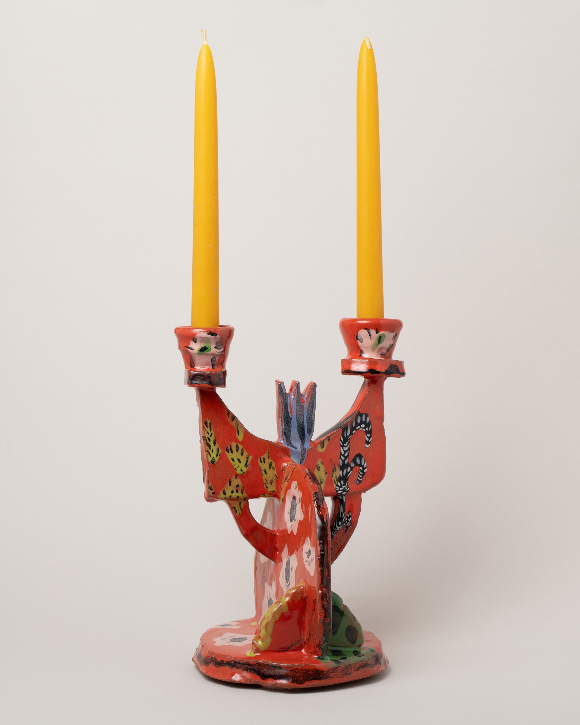 Maggie Boyd Red Hot Candelabra on light color background.