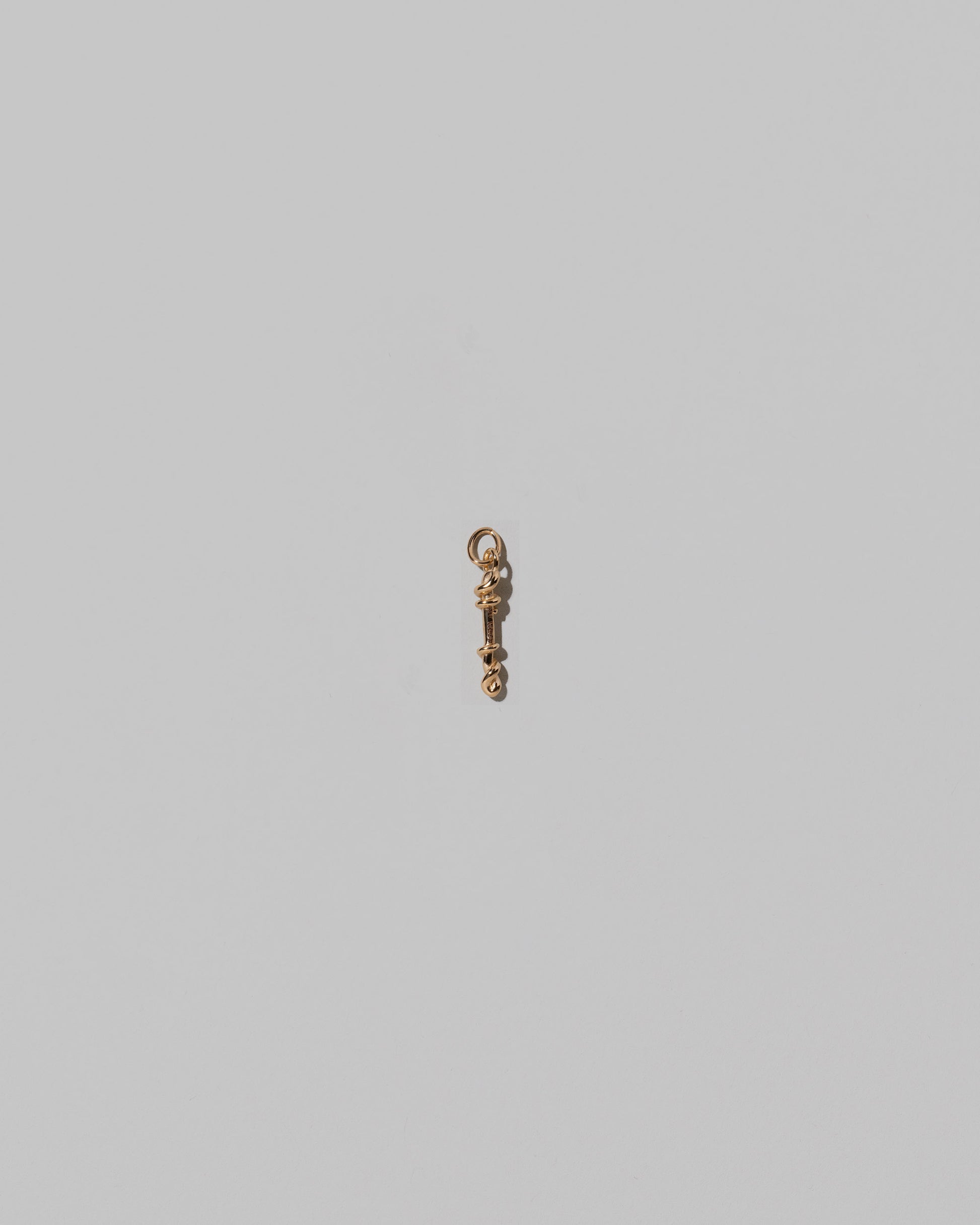 CRZM Mini Letter I set in solid gold on light color background.