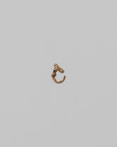 CRZM Mini Letter C set in solid gold on light color background.