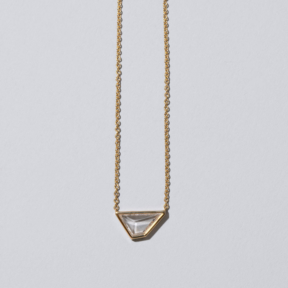 product_details::Closeup details of the Amplify Necklace on light color background.