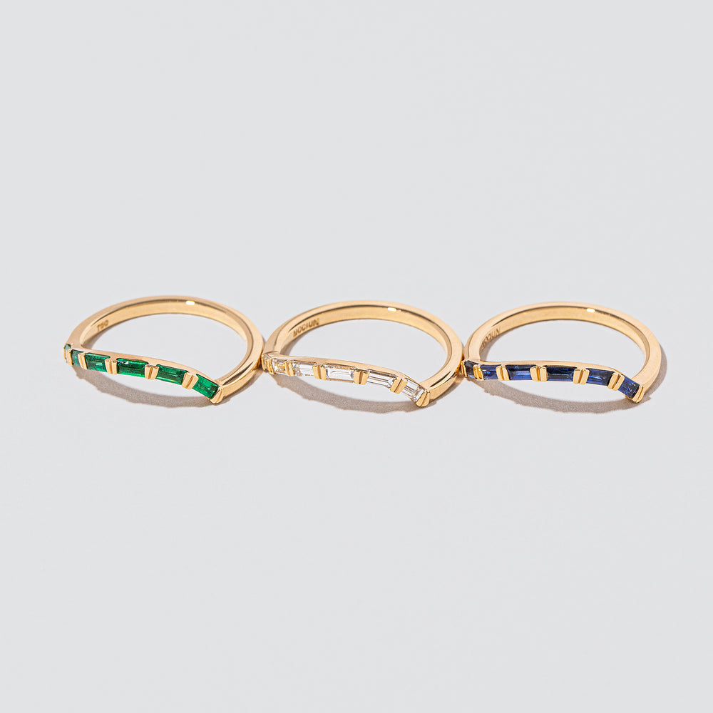 product_details::Gold Baguette Right Slump Bands on light color background.