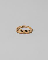 Gold Pavé Bind Band on light color background.