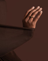 Styled image featuring the Gold Pavé Bind Band.