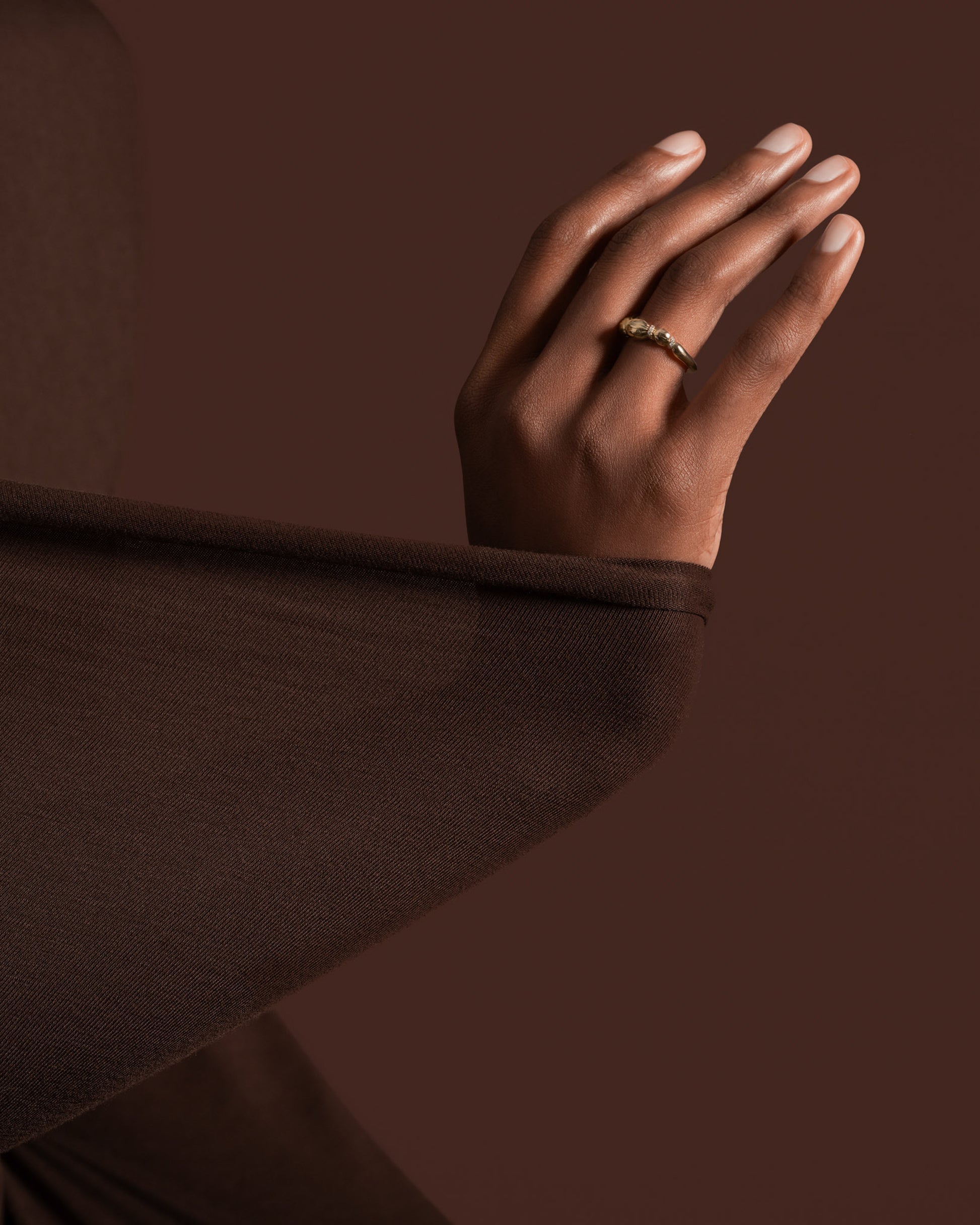 Styled image featuring the Gold Pavé Bind Band.