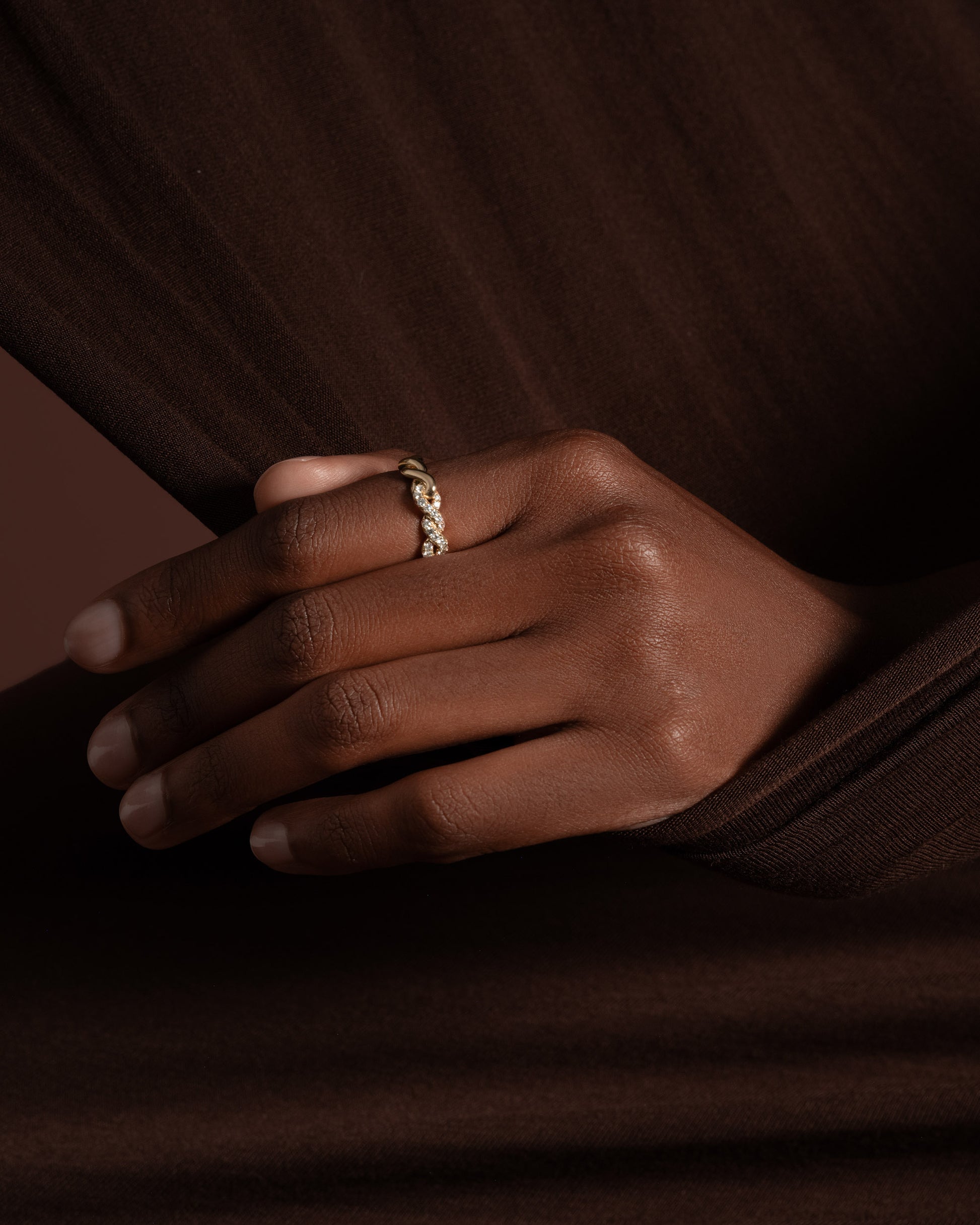 Styled image featuring the Gold Pavé Twist Band.