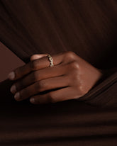 Styled image featuring the Gold Pavé Twist Band.