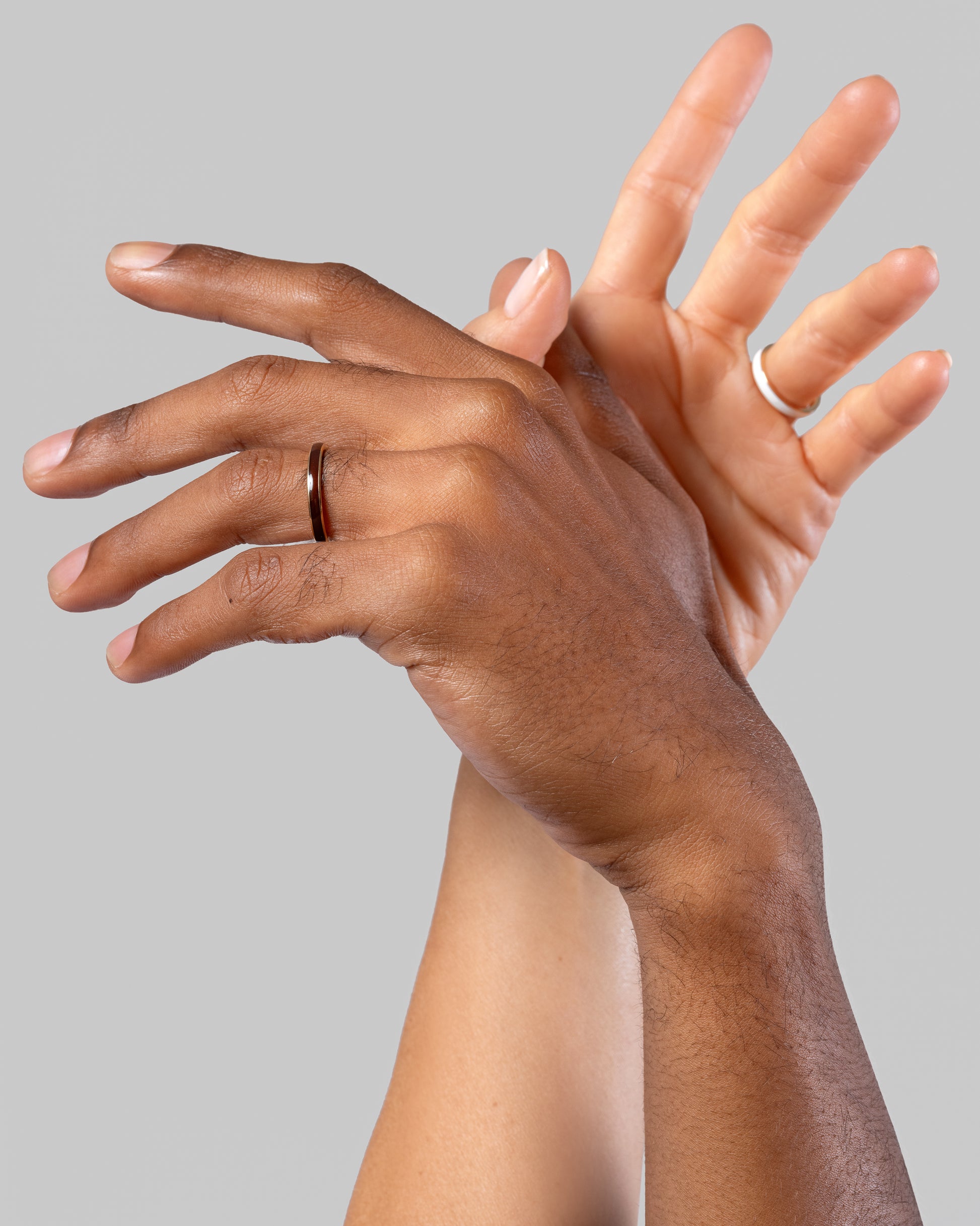 Gold 3mm Enamel Band in Moonbeam Moonbeam and Gold 3mm Enamel Band in Ink on models.