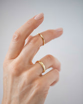 Gold 4mm Facet Band and Gold 2mm Facet Band on model.