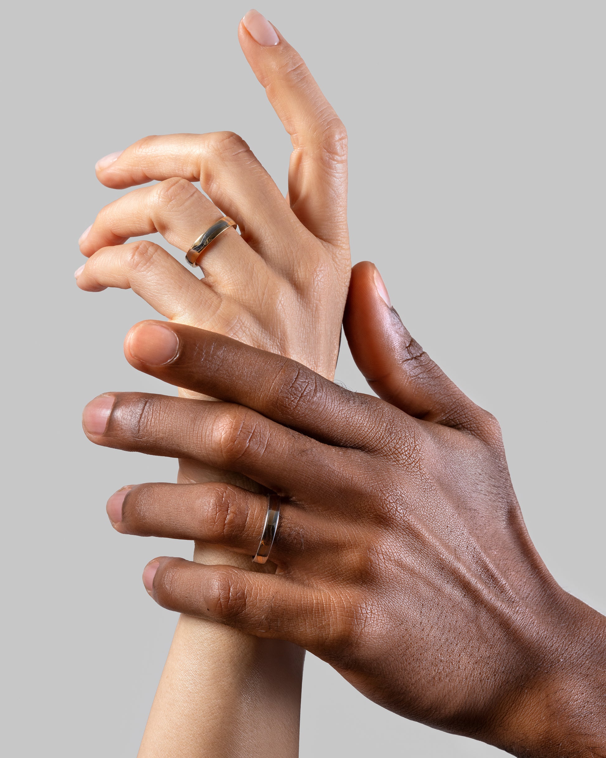 4mm Platinum Outside, 18K Inside Swimming Pool Band and 4mm 18K Outside and Platinum Inside Swimming Pool Band on models.