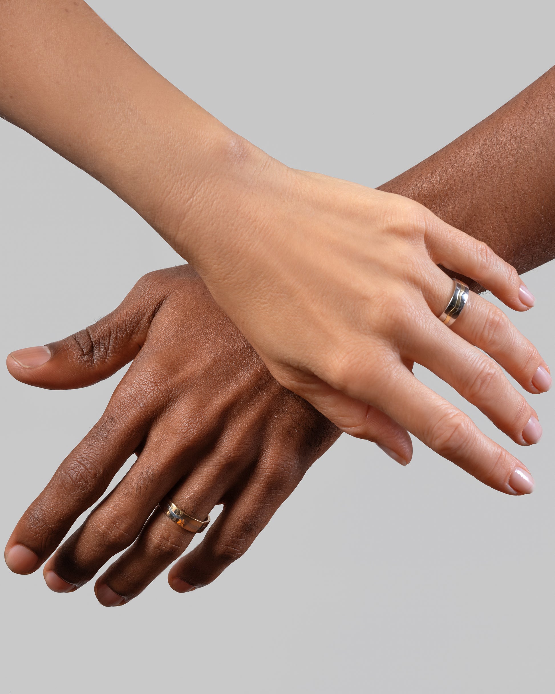 6mm Platinum Outside, 18K Inside Swimming Pool Band and 5mm Three Tone Swimming Pool Band on models.