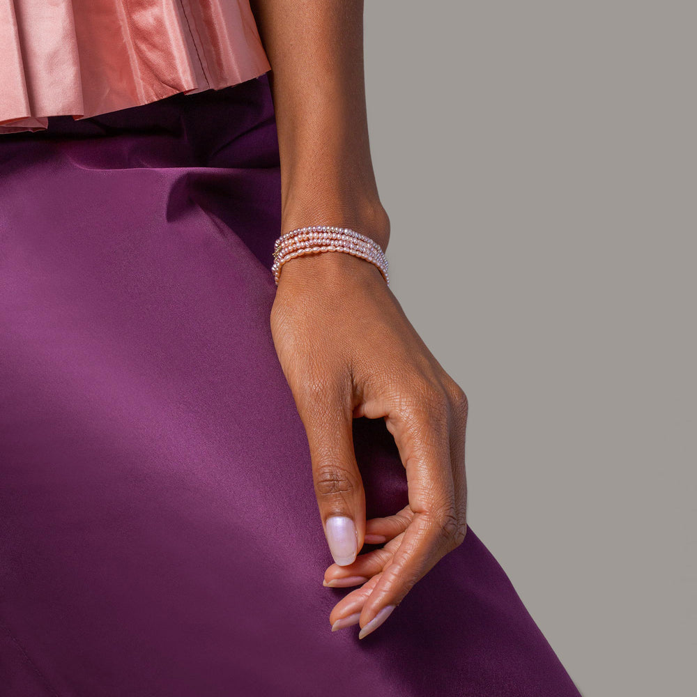 product_details::Lavender Pebble Seed Pearl Bracelet, Pink Pebble Seed Pearl Bracelets and Pink Oval Seed Pearl Bracelet on model.