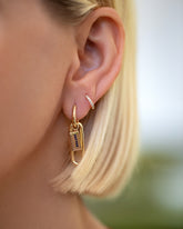 Stick of Salted Butter Charm paired with Huggie Gold Solid Snack Hoop Earrings and styled with the Huggie Gold Diamond Snack Hoop Earrings on model.