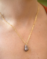 Curled-Up Cat Charm paired with 3.5mm Lightweight Beveled Oval Chain Necklace on model.