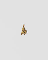 View from the back of the Bruised Banana Peel Charm on light color background.