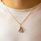 product_details::Bruised Banana Peel Charm and Hot Dog Chain Necklace on model.