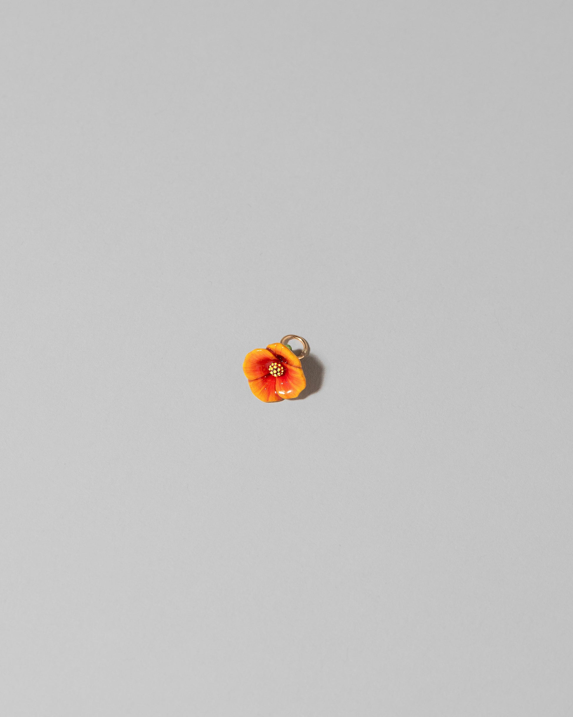 California Poppy Charm on light color background.