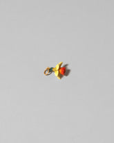 View from the side of the Daffodil Charm on light color background.