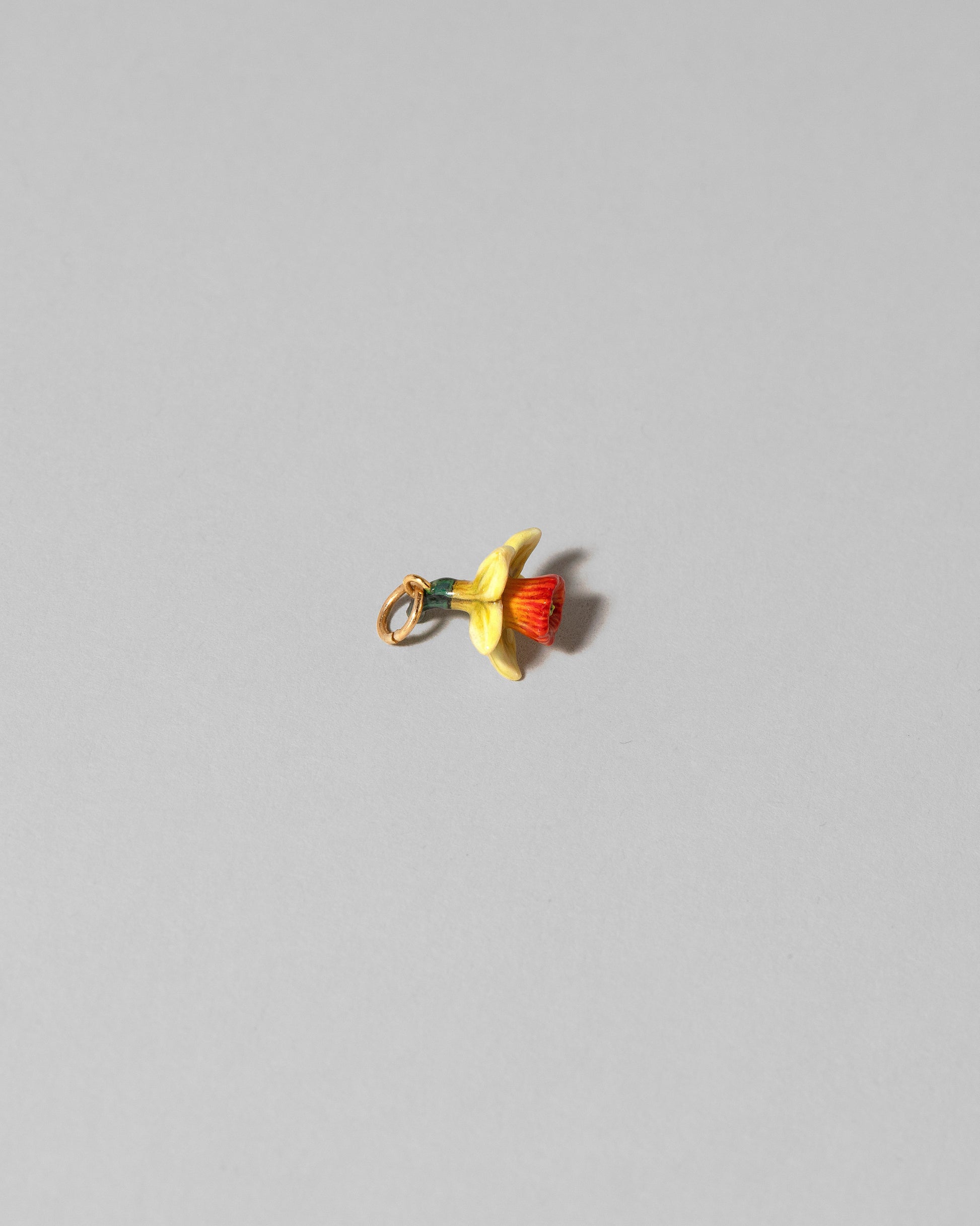 View from the side of the Daffodil Charm on light color background.