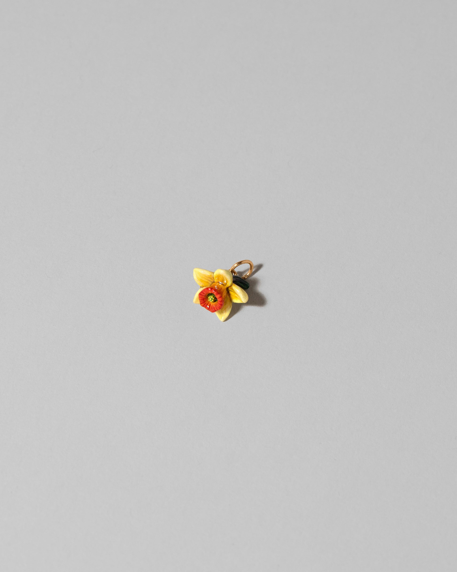 View from the side of the Daffodil Charm on light color background.