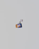 Instant Ramen Charm on light color background.