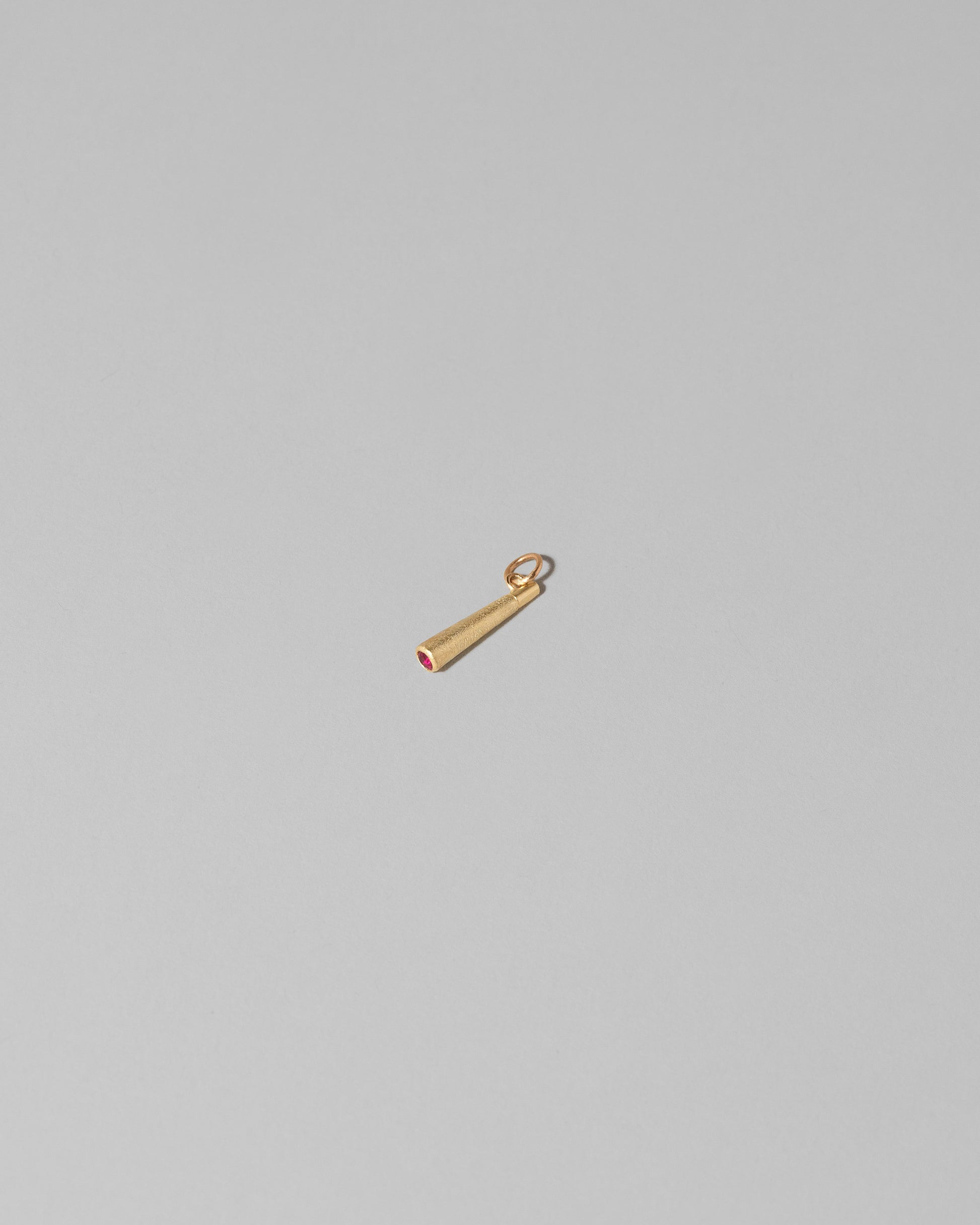 Lit Joint Charm on light color background.