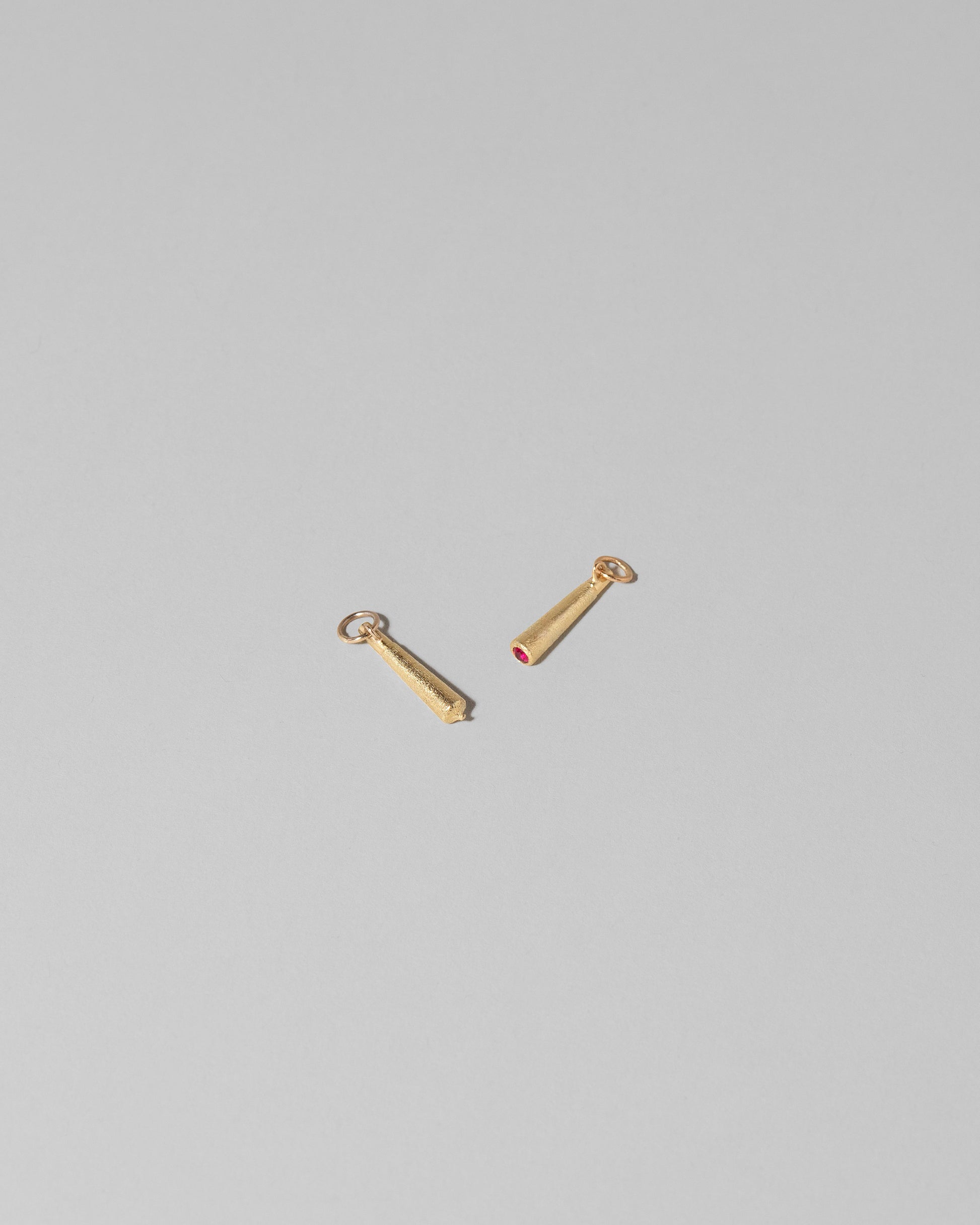 Joint Charm and Lit Joint Charm on light color background.