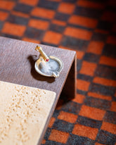 Styled image featuring the Lit Joint Charm.