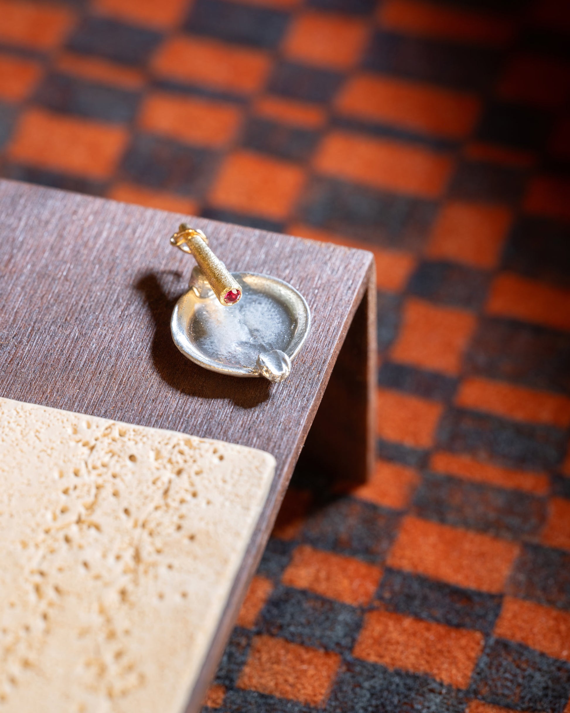 Styled image featuring the Lit Joint Charm.