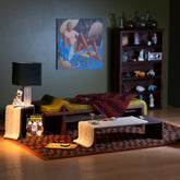 product_details::Styled image of charms from the Small Pleasures Collection, set inside.