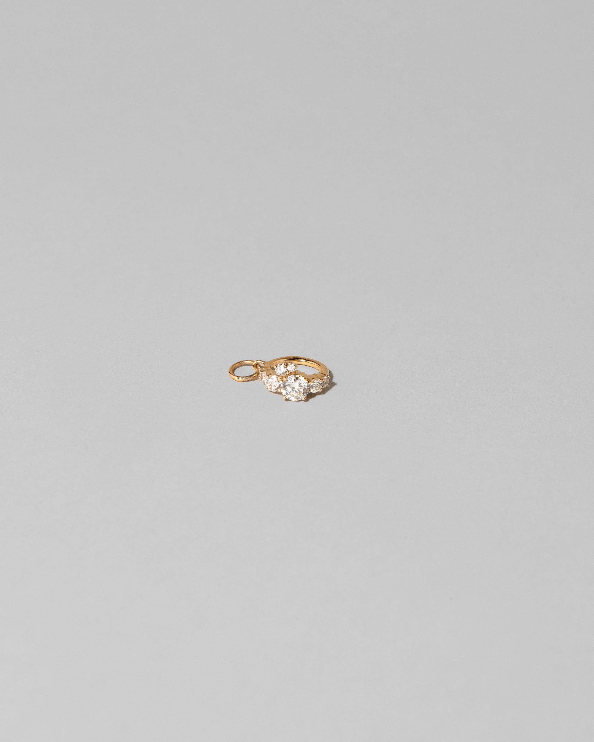 Closeup details of the Luna Ring Charm on light color background.