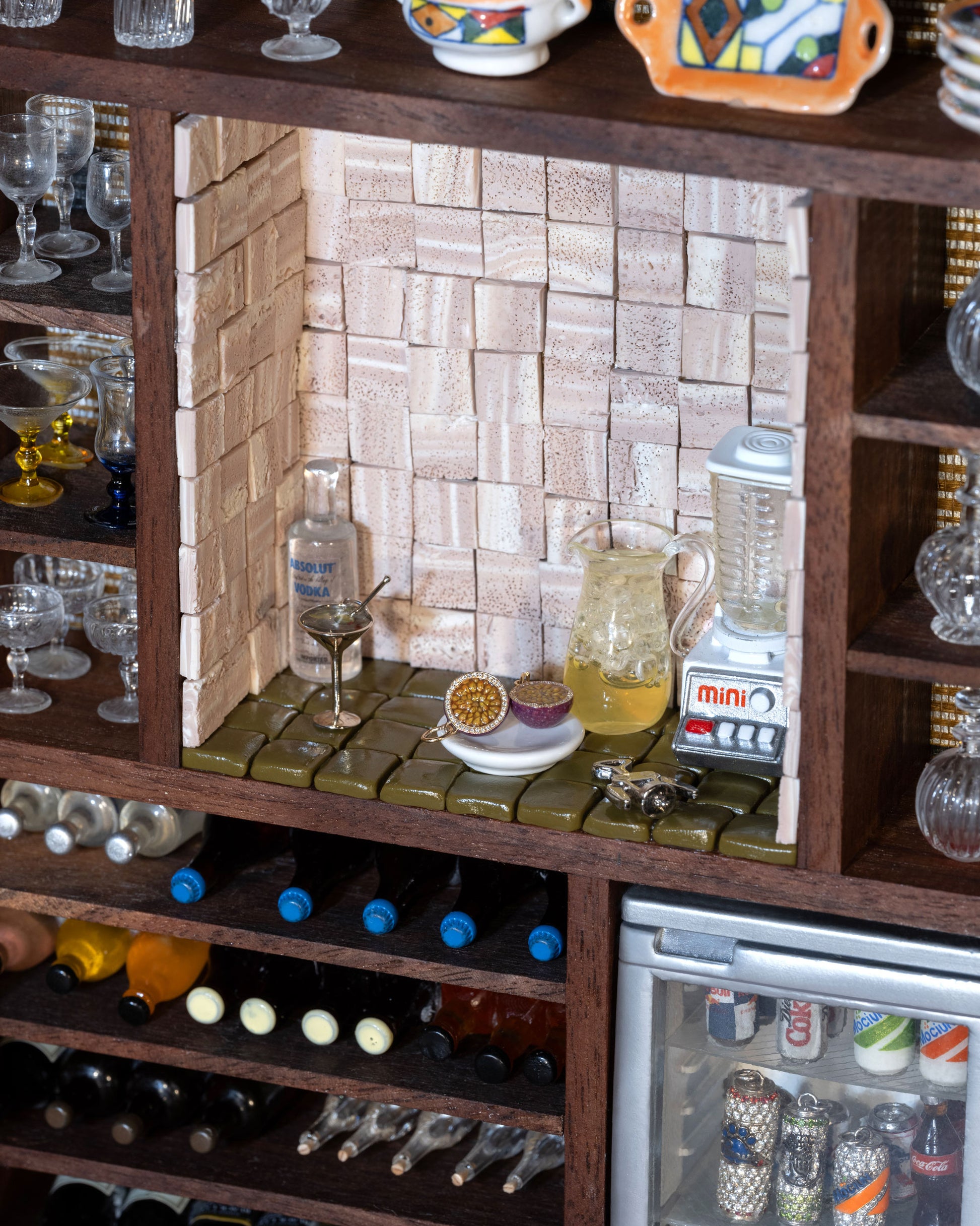 Styled image featuring the Halved Passion Fruit Charms, with the Dirty Martini Charm, Paws Blue Ribbon Aluminum Can Charm, La Cleo Aluminum Can Charm and White Paw Aluminum Can Charm.