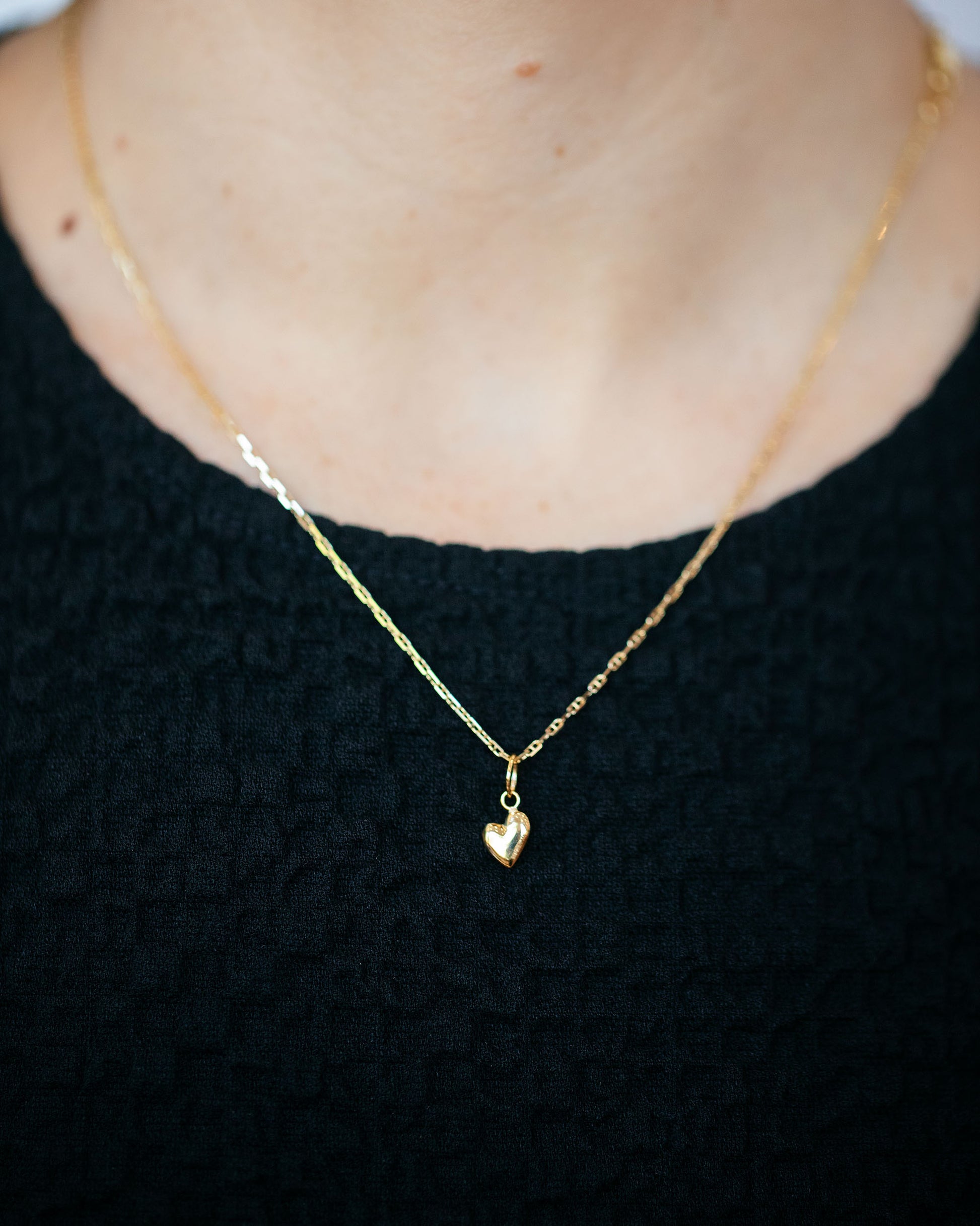 Hot Dog Chain Necklace and Gold Thousand & One Night Heart Charm on model.